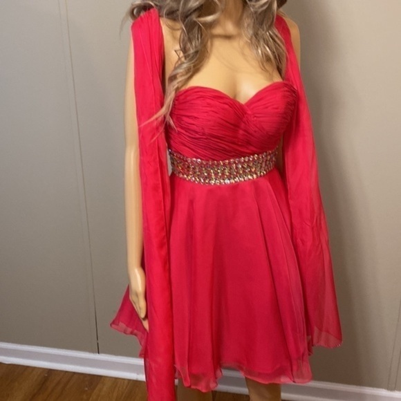 Size 0 blush prom dress worn once. Its a knee length dress has a sash with it - Picture 5 of 7